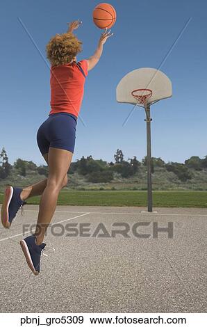 African woman shooting basketball View Large Photo Image Stock Photo - African woman shooting basketball. Fotosearch