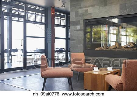 Cafe table and chairs next to fireplace View Large Photo Image Stock Photograph - Cafe table and chairs next to fireplace. Fotosearch