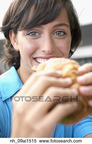 Close up of Hispanic woman eating sandwich View Large Photo Image Stock Photography - Close up of Hispanic woman eating sandwich. Fotosearch