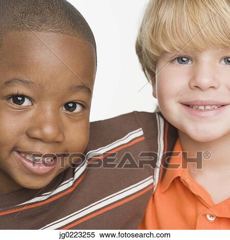 Stock Photography - Close up of two young boys smiling. Fotosearch