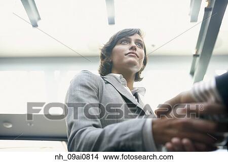 Hispanic businesswoman shaking hands View Large Photo Image Picture - Hispanic businesswoman shaking hands. Fotosearch