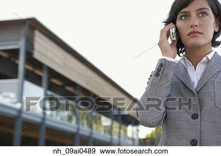 Hispanic businesswoman talking on cell phone View Large Photo Image Stock Photo - Hispanic businesswoman talking on cell phone. Fotosearch