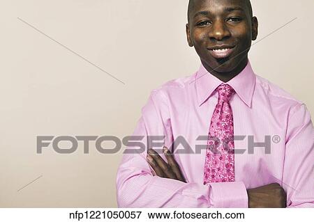 Portrait of African businessman with arms crossed View Large Photo Image Stock Photo - Portrait of African businessman with arms crossed. Fotosearch