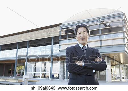 Portrait of Asian businessman with arms crossed View Large Photo Image Stock Image - Portrait of Asian businessman with arms crossed. Fotosearch