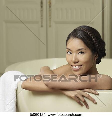 Portrait of Asian woman in bathtub View Large Photo Image Picture - Portrait of Asian woman in bathtub. Fotosearch