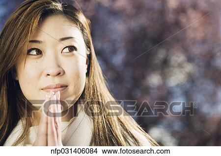 Picture - Portrait of Asian woman praying . Fotosearch