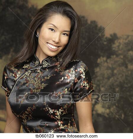 Stock Image - Portrait of Asian woman wearing traditional dress . Fotosearch