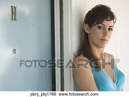 Portrait of Hispanic woman next to hotel room door View Large Photo Image Stock Photograph - Portrait of Hispanic woman next to hotel room door. Fotosearch