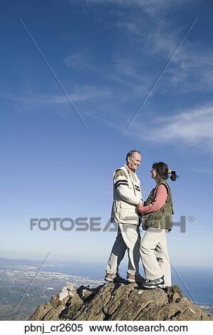 Senior couple on top of cliff View Large Photo Image Stock Photography - Senior couple on top of cliff. Fotosearch