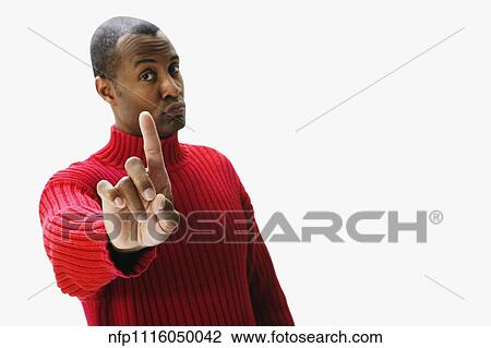 African man holding index finger up and pursing lips View Large Photo Image Stock Image - African man holding index finger up and pursing lips. Fotosearch