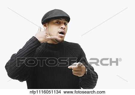 African man making telephone hand gesture and pointing View Large Photo Image Picture - African man making telephone hand gesture and pointing. Fotosearch