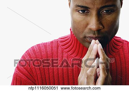 African man with hands together in front of chin View Large Photo Image Stock Image - African man with hands together in front of chin. Fotosearch