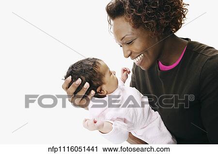 African mother smiling at baby View Large Photo Image Stock Image - African mother smiling at baby. Fotosearch