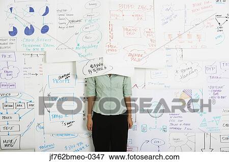 Asian businesswoman with head under flow chart View Large Photo Image Stock Photo - Asian businesswoman with head under flow chart. Fotosearch