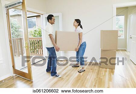 Asian couple moving box in new house View Large Photo Image Stock Image - Asian couple moving box in new house. Fotosearch