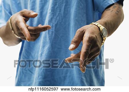 Stock Photo - Close up of African man pointing. Fotosearch