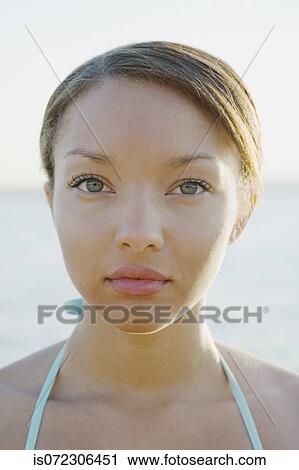 Close up of African woman with hair pulled back View Large Photo Image Stock Image - Close up of African woman with hair pulled back. Fotosearch