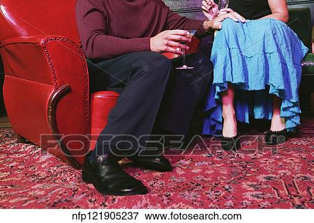 Couple holding cocktails View Large Photo Image Stock Photo - Couple holding cocktails. Fotosearch
