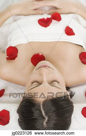 Hispanic woman covered in flower petals View Large Photo Image Stock Photograph - Hispanic woman covered in flower petals. Fotosearch