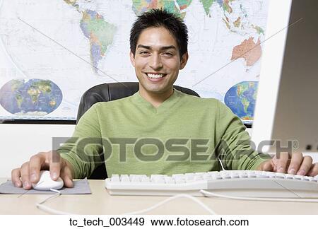 Pacific Islander businessman in front of world map View Large Photo Image Stock Photo - Pacific Islander businessman in front of world map. Fotosearch