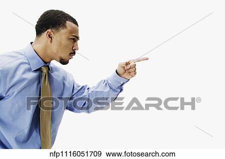 Portrait of African businessman pointing View Large Photo Image Stock Photo - Portrait of African businessman pointing. Fotosearch