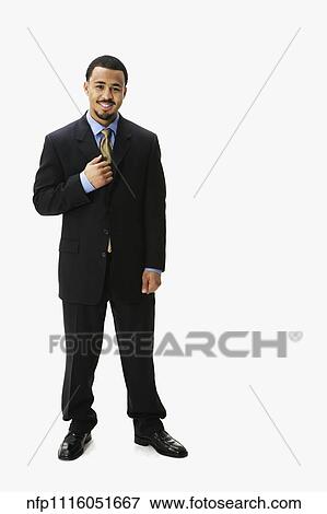 Portrait of African businessman with hand on lapel View Large Photo Image Stock Photo - Portrait of African businessman with hand on lapel. Fotosearch