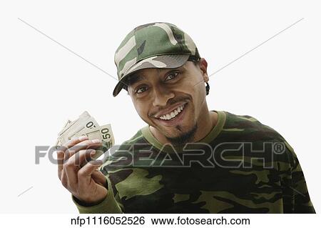 Stock Photograph - Portrait of African man holding handful of money. Fotosearch