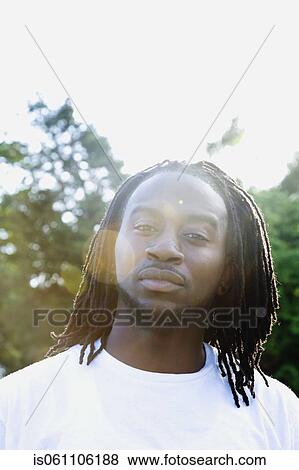 Stock Photo - Portrait of African man in sunlight. Fotosearch