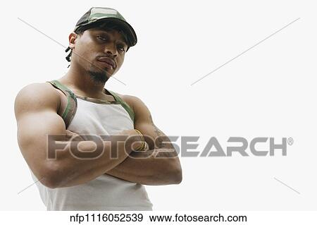 Portrait of African man with arms crossed View Large Photo Image Stock Photo - Portrait of African man with arms crossed. Fotosearch