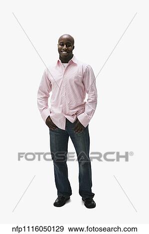 Stock Photo - Portrait of African man with thumbs in pockets. Fotosearch