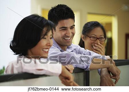 Picture - Portrait of Asian businesspeople laughing. Fotosearch