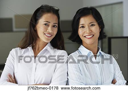 Stock Photo - Portrait of Asian businesswomen in office. Fotosearch