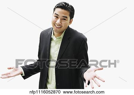 Portrait of Asian man shrugging shoulders View Large Photo Image Stock Image - Portrait of Asian man shrugging shoulders. Fotosearch