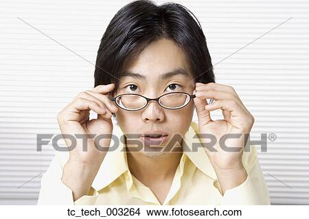 Picture - Portrait of Asian man wearing eyeglasses. Fotosearch