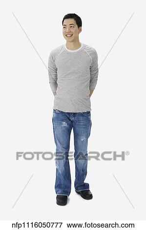 Portrait of Asian man with hands behind back View Large Photo Image Stock Photo - Portrait of Asian man with hands behind back. Fotosearch