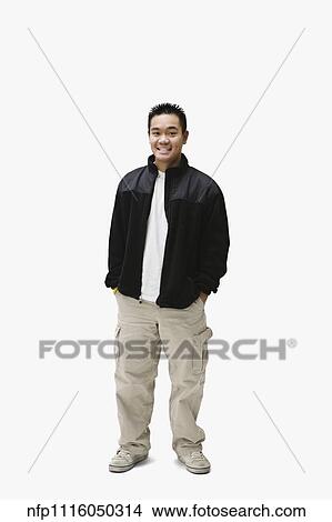 Portrait of Asian man with hands in pockets View Large Photo Image Picture - Portrait of Asian man with hands in pockets. Fotosearch