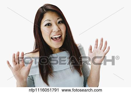 Stock Image - Portrait of Asian woman looking surprised. Fotosearch