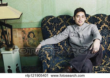Portrait of Pacific Islander man on sofa View Large Photo Image Stock Image - Portrait of Pacific Islander man on sofa. Fotosearch