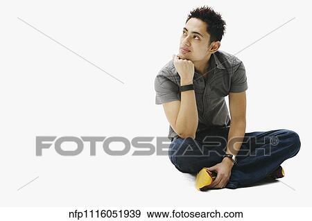 Portrait of Pacific Islander man sitting cross-legged View Large Photo Image Stock Photo - Portrait of Pacific Islander man sitting cross-legged. Fotosearch