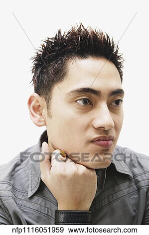 Portrait of Pacific Islander man leaning chin on fist View Large Photo Image Stock Photo - Portrait of Pacific Islander man leaning chin on fist. Fotosearch