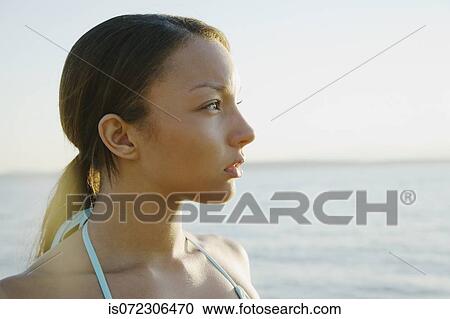 Profile of African woman with hair pulled back View Large Photo Image Stock Image - Profile of African woman with hair pulled back. Fotosearch
