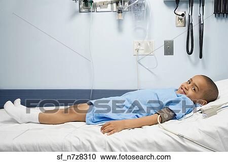 African boy in hospital bed with blood pressure cuff View Large Photo Image Stock Image - African boy in hospital bed with blood pressure cuff . Fotosearch