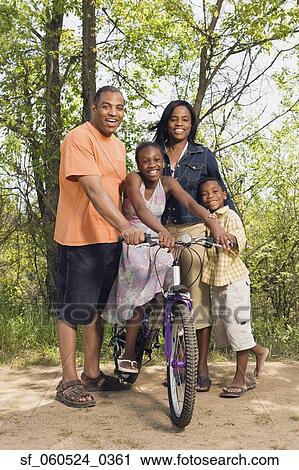 African family with bicycle in park View Large Photo Image Stock Image - African family with bicycle in park. Fotosearch