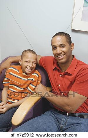 African father and son in waiting room View Large Photo Image Stock Image - African father and son in waiting room. Fotosearch