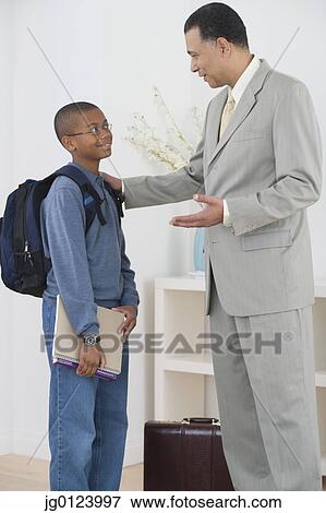 African father seeing son off to school View Large Photo Image Stock Photo - African father seeing son off to school. Fotosearch