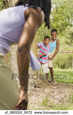 African sister and brother playing with mother in park View Large Photo Image Stock Image - African sister and brother playing with mother in park. Fotosearch
