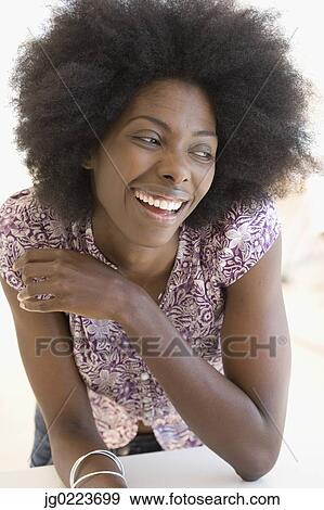 Stock Photo - African woman laughing. Fotosearch