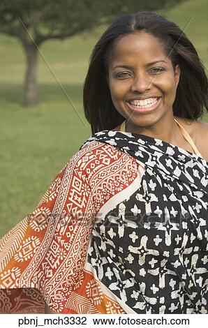 African woman wearing dress outdoors View Large Photo Image Stock Image - African woman wearing dress outdoors. Fotosearch