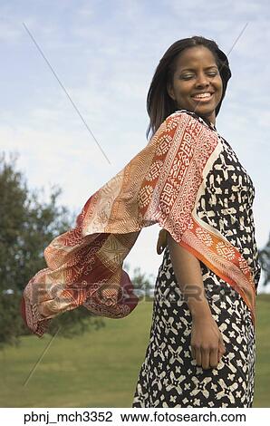 African woman wearing dress outdoors View Large Photo Image Stock Image - African woman wearing dress outdoors. Fotosearch