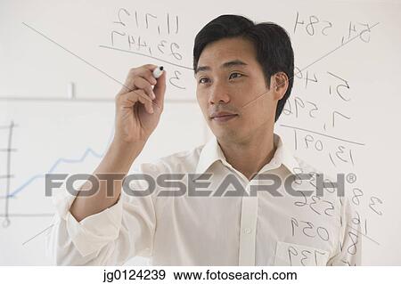 Asian businessman writing on white board View Large Photo Image Stock Photo - Asian businessman writing on white board. Fotosearch